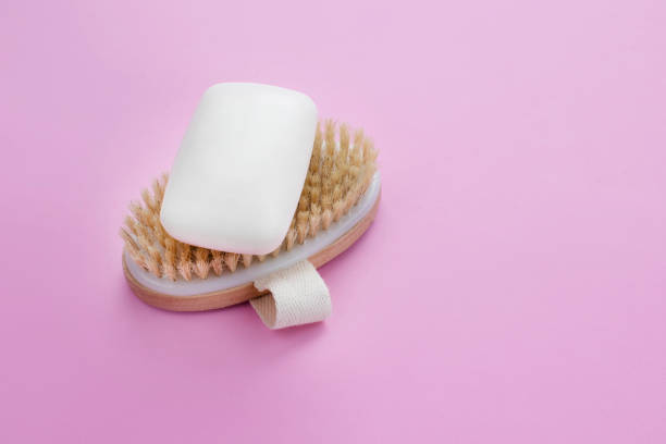 istock White soap bar on wooden brush. 1305784118