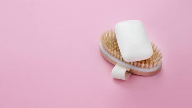 istock White soap bar on wooden brush. 1305784191