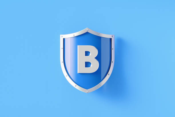 Silver shield with letter B sitting on blue background, Horizontal composition with copy space. Vitamin B Concept.