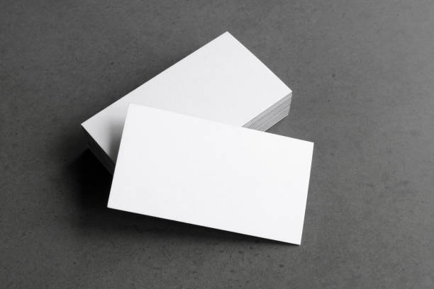 istock Business card on black background. 1305786914