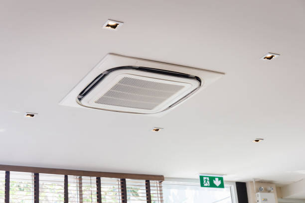 istock Modern ceiling mounted cassette type air conditioning system in coffee shop 1305788623