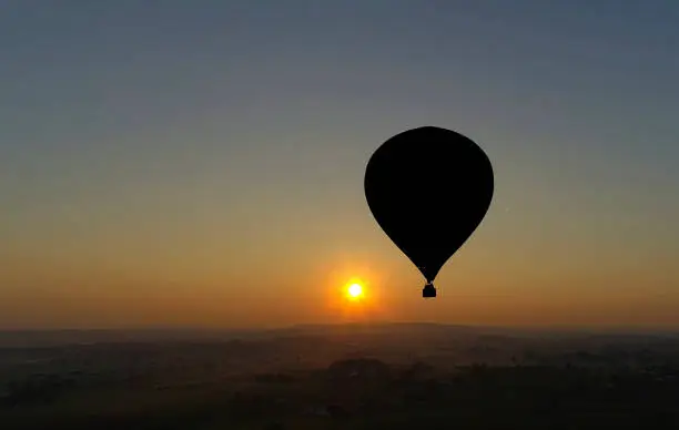 Photo of Hot Air Balloons Taking Off at Sunrise