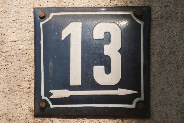 istock Weathered enamelled plate number 13 1305789665