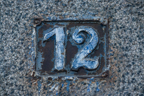 istock Old retro cast iron plate number 12 1305789688