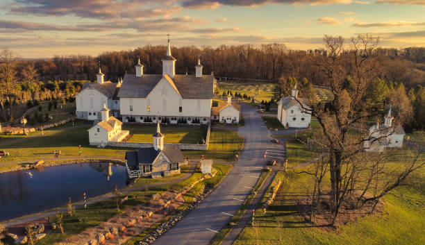 Aerial View at Sunset of Antique Restored Barns An Aerial View at Sunset of Antique Restored Barns amish photos stock pictures, royalty-free photos & images