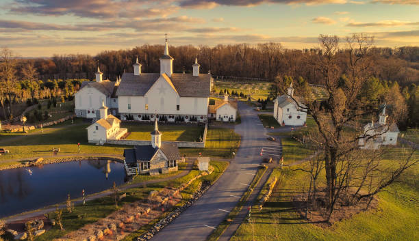 Aerial View at Sunset of Antique Restored Barns An Aerial View at Sunset of Antique Restored Barns Amish stock pictures, royalty-free photos & images