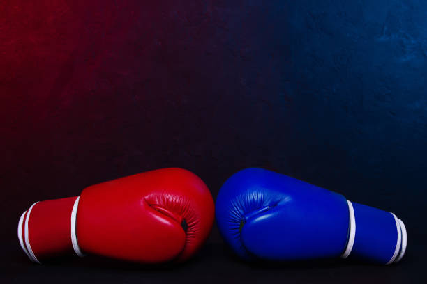 istock Boxing gloves Red and Blue hitting together poster design. 1305790769