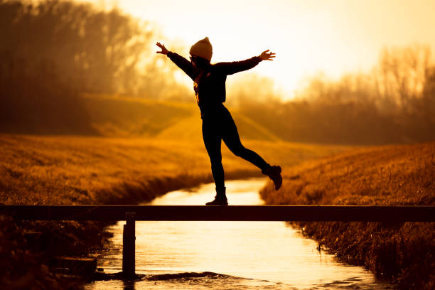 istock dancing woman on a small bridge 1305790778