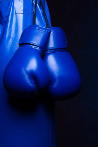 istock Boxing gloves poster background. 1305790794