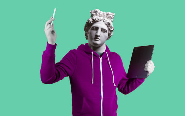 Modern art collage. Concept portrait man holding tablet and pencil. Gypsum head of Apollo. Modern art collage. Concept portrait man holding tablet and pencil. Gypsum head of Apollo. mobile sculpture stock pictures, royalty-free photos & images