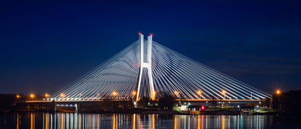 istock Wroclaw Redzinski Bridge over the Odra River, the illuminated bridge is reflected in the water. 1305792654