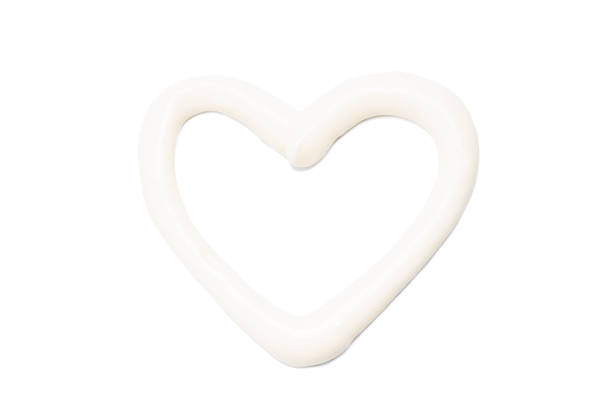 mayonnaise sauce isolated on white background. mayo paste cut out. heart shape