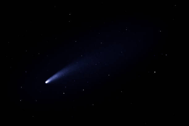 Shining comet in a starry night sky.