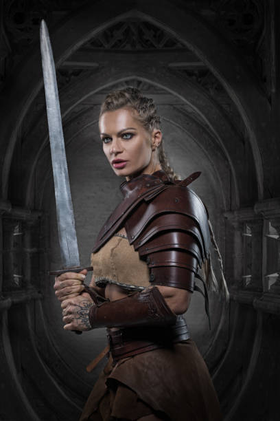 istock Beautiful Blonde viking warrior female in studio shot 1305796646