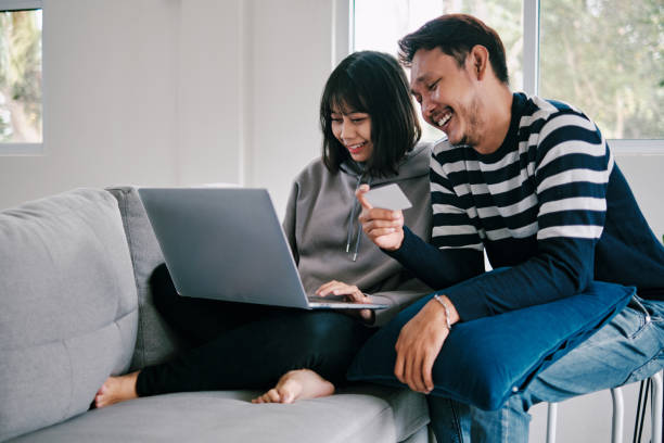 istock Couple Shopping Using Laptop with Credit Card 1305796808