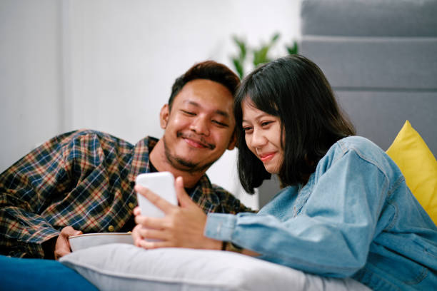 istock Couple Shopping Using Phone with Credit Card 1305796992