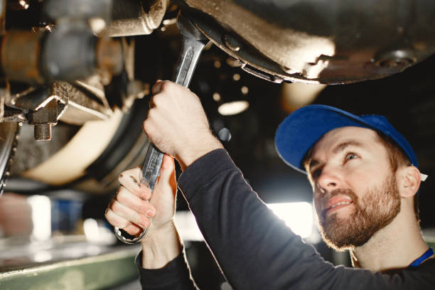 istock ar mechanic repairs blue car on rise in garage 1305797156
