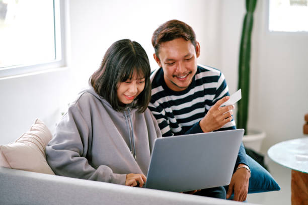 istock Couple Shopping Using Laptop with Credit Card 1305798008