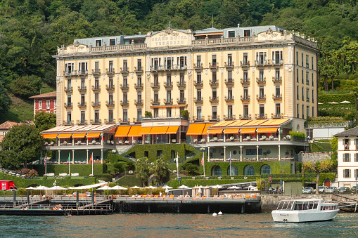 Tourists are visible outside the five star Grand Hotel Tremezzo on Lake Como in Lombardy, Italy