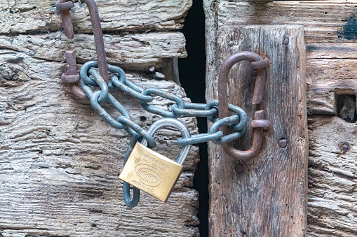 Padlock in Varenna on Lake Como, Italy, with the manufacturer's name visible on the outside