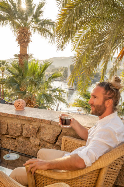 istock Man contemplates the Nile river in Aswan 1305802330