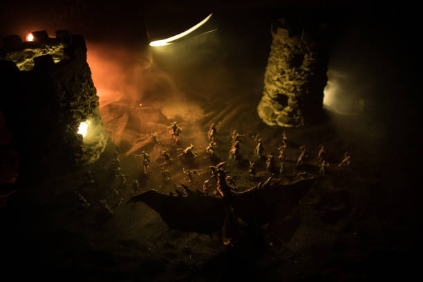 istock Battle between dragon and heroic soldiers. Creative table decoration. Selective focus 1305802948