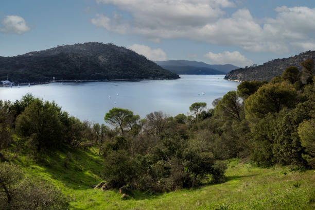 Pantano de San Juan on a sunny day with nice clouds. San Juan reservoir near Pelayos de la presa in Madrid Pantano de San Juan on a sunny day with nice clouds. San Juan reservoir near Pelayos de la presa in Madrid. Landscape photography reservoir stock pictures, royalty-free photos & images
