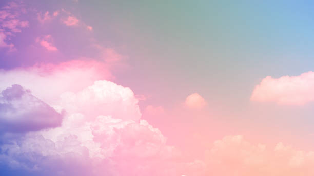istock beauty soft pastel colors with fluffy white abstract clouds on sky. multi color rainbow image 1305805627