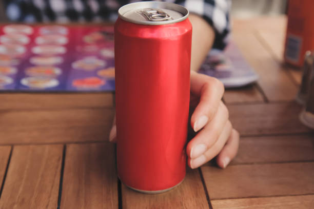 Woman holding aluminum can