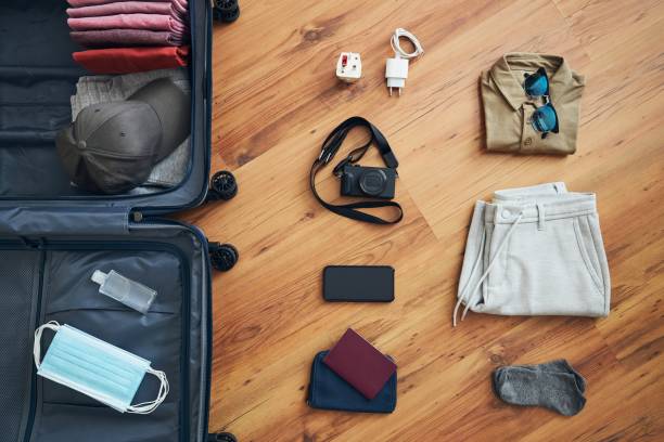 istock Packing suitcase for travel in new normal 1305808415
