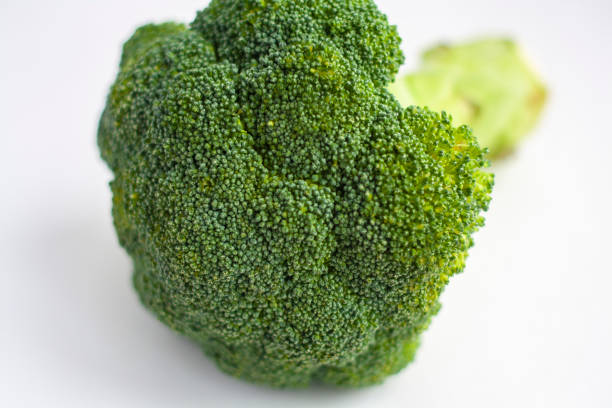 istock Ripe raw broccoli, inflorescence, on a white background, macro 1305810168