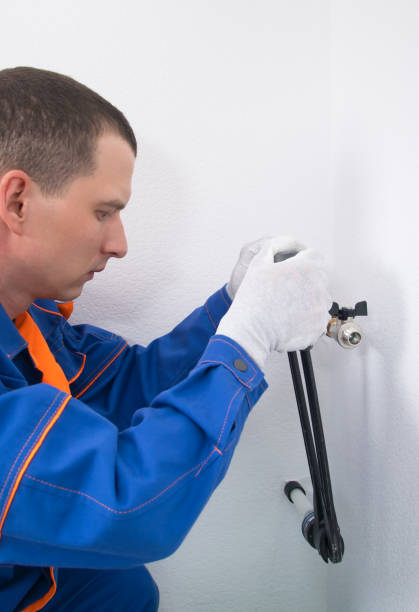 istock plumber, professional equipment, does hot water pipe crimping 1305811170