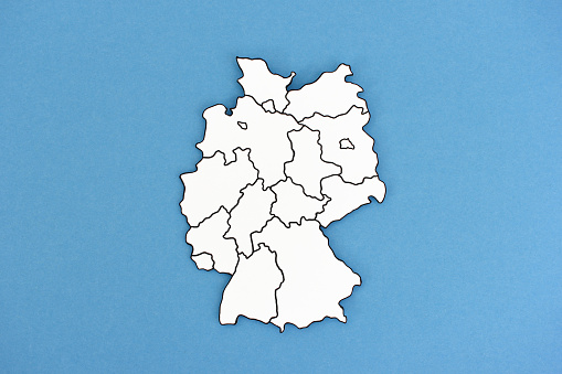 Map of Germany with its 16 constituent states cut out of paper