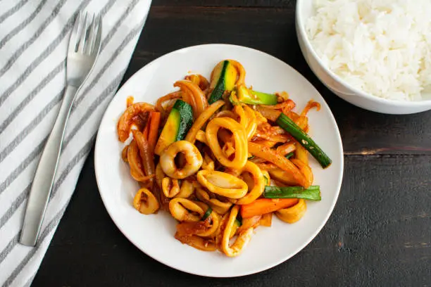 A Korean seafood dish made with squid and vegetables stir-fried in a sweet and spicy sauce