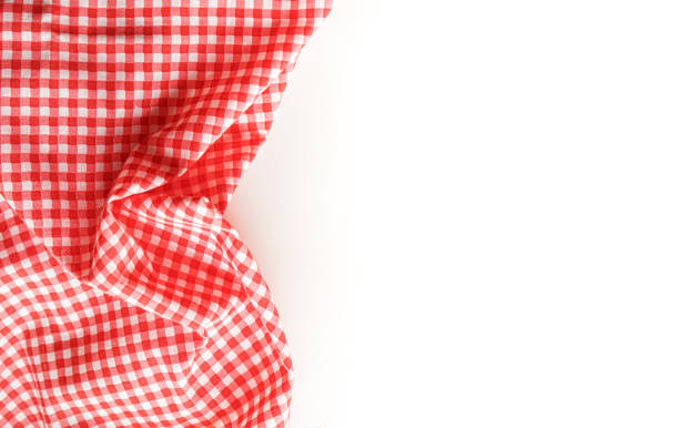 istock crumble pink plaid fabric or tablecloth on white background with copy space. 1305820252