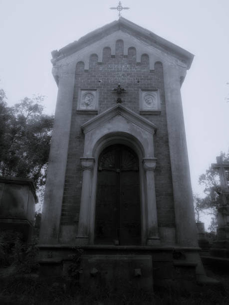 istock Crypt in a dark scary cemetery. Monumental religious building. 1305820616