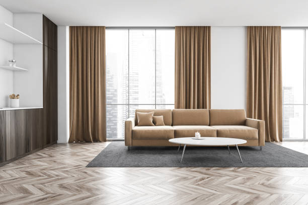 istock Wooden and beige kitchen set with sofa near window with curtains 1305821704