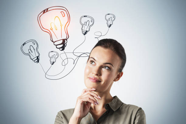 istock Thoughtful woman and lightbulb sketch 1305823241