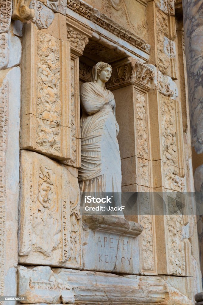 Sculpture of Arete on restored facade of Celsus Library in Ephesus, Turkey Sculpture of Greek mythology goddess Arete, personification of virtue, on restored facade of Celsus Library in  ancient settlement of Ephesus in Turkey Ancient Stock Photo