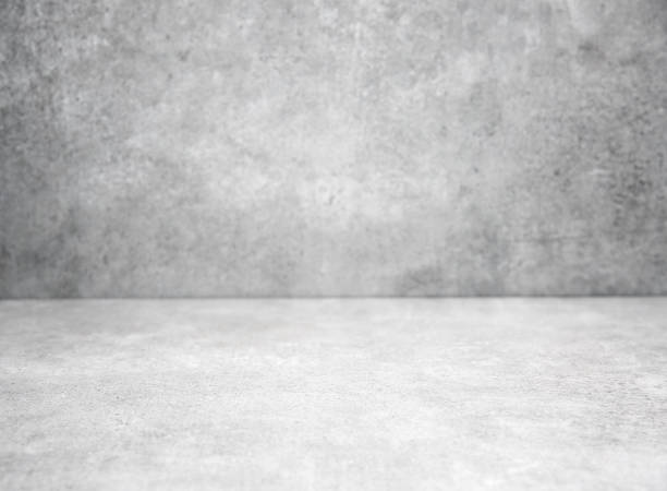 istock Grey stone grungy stage,empty room background,free space interior.Cement wall.Advertisement design studio.Modern backdrop. 1305827118