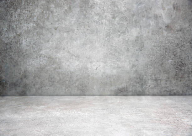 istock Grey stone grungy stage,empty room background,free space interior.Cement wall.Advertisement design studio.Modern backdrop. 1305827122
