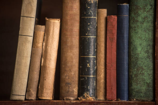 istock Antique Books Lined Across a Shelf 1305831116