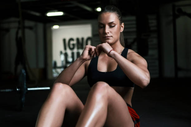 istock Fitness woman doing abs crunches 1305831570