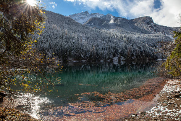 istock lake in mountains between autumn and winter 1305831806