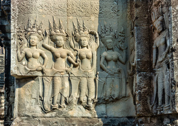 Siem Reap, Cambodia - January 22, 2020: Deep relief of dancing Apsaras at Angkor Wat temple, Cambodia. The Angkor Wat is a Hindu temple complex in Cambodia and is the largest religious monument in the world.