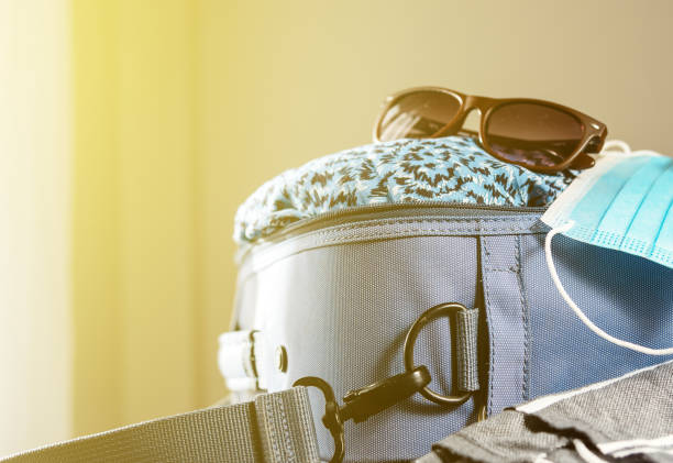 istock Travel bag packed for trip. 1305834069