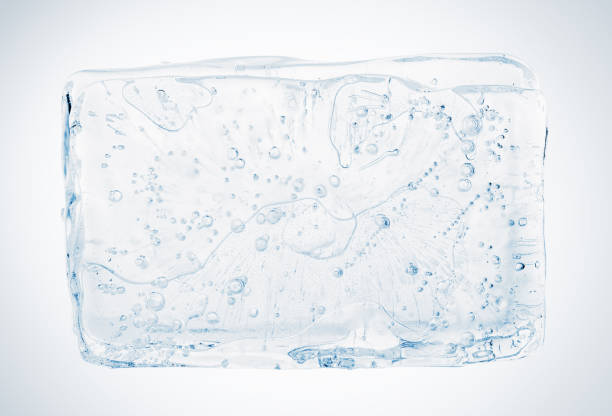 istock Crystal clear natural ice block with air bubbles, isolated on white background. 1305837124
