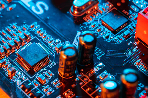 istock Electronic components on a printed circuit board. Resistor, inductor and capacitor on PCB. Concept Electrical engineering, microprocessor, technology. Selective focus. 1305840738