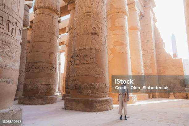 Woman Walking In The Ancient Egyptian Temple In Luxor Stock Photo - Download Image Now