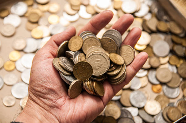 istock Showing Old Coins by a Man 1305843101